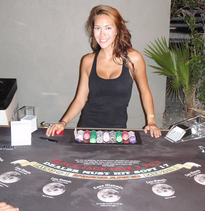 Ciara dealing on the Luna Malvada custom blackjack table